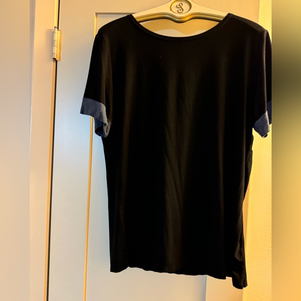Sarin Mathew’s black top with blue gray trim on sleeves Size XL